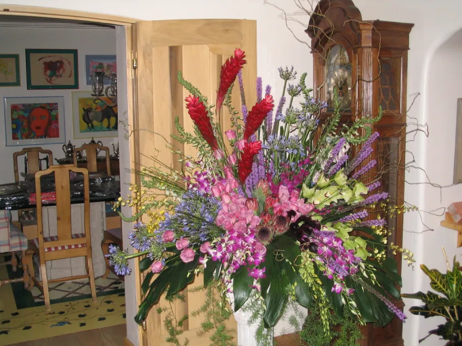 Gifting and client appreciation floral services with red ginger, pink roses, purple orchids, and mixed blooms in Phoenix
