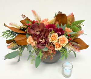 Burgundy orchid and magnolia Thanksgiving flowers and centerpieces in Phoenix with peach roses and berries